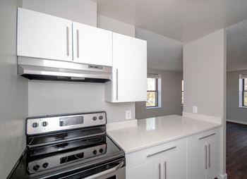 Urban kitchens with chic white cabinets and stainless steel appliances